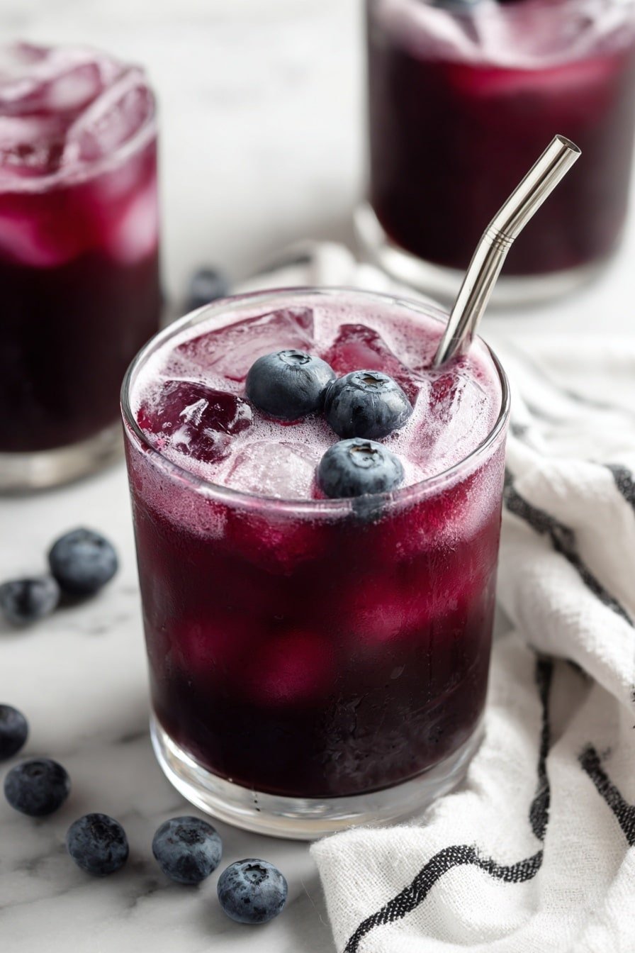 Blueberry Soda Recipe - Article Image 1 — Blueberry Soda, homemade blueberry soda, blueberry sparkling drink, blueberry syrup drink, refreshing blueberry beverage