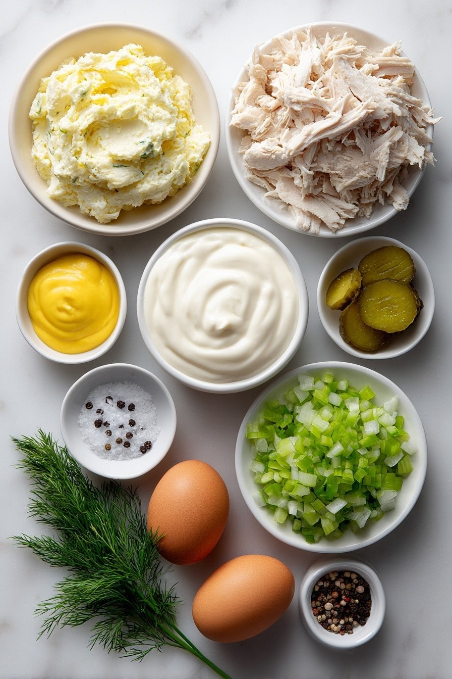 Flat lay of shredded cooked chicken breast, chopped dill pickles with visible seeds and brine moisture, bright green chopped celery stalks, finely chopped white onion pieces, a small white ceramic bowl of creamy Greek yogurt, a small white ceramic bowl of smooth mayonnaise, a small white ceramic bowl of golden yellow mustard, fresh green chive sprigs, fresh dill sprigs with feathery leaves, two whole uncracked brown eggs, small white ceramic bowls containing coarse salt and cracked black peppercorns placed symmetrically, all arranged on simple white ceramic bowls and plates without overlap, balanced and realistic proportions, natural fresh textures and colors, placed on a clean white marble surface, soft natural light, photo taken with an iPhone, professional food photography style, fresh ingredients, white ceramic bowls, no bottles, no duplicates, no utensils, no packaging --ar 2:3 --v 7 --p m7354639359234015250 — Dill Pickle Chicken Salad, chicken salad with dill pickles, easy chicken salad recipe, tangy chicken salad, quick lunch chicken salad