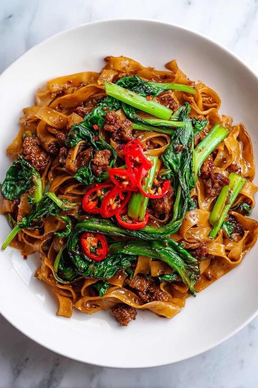 Easy Drunken Noodles Recipe - Article Image 2 — Easy Drunken Noodles, Thai drunken noodles recipe, flavorful stir-fry with basil, quick Asian noodle dish, homemade drunken noodles