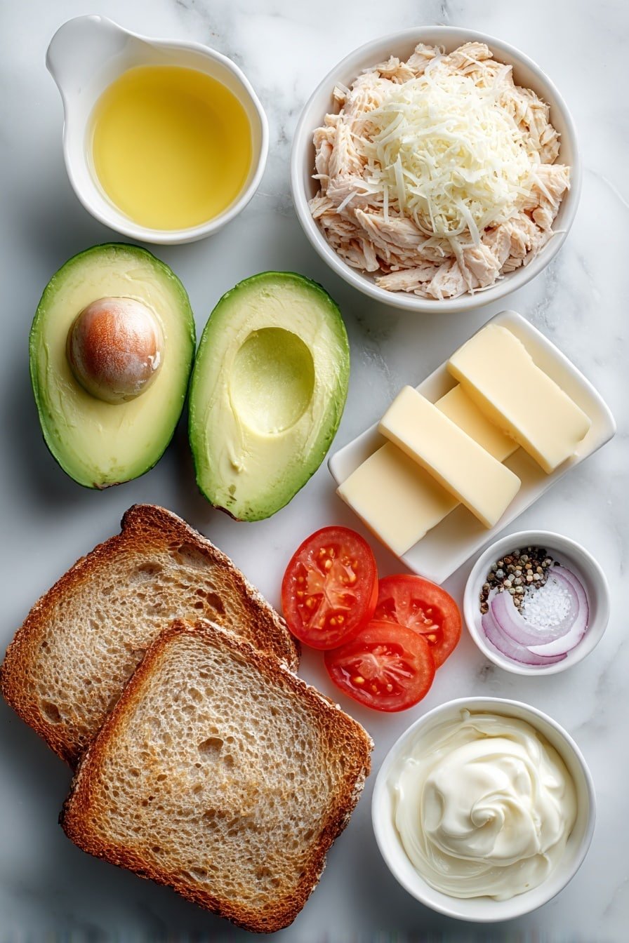 Flat lay of two thick slices of artisanal sourdough bread, half a ripe avocado cut in half with a generous scoop mashed next to it, a small white ceramic bowl of shredded grilled chicken, two slices of sharp cheddar cheese, a small white ceramic bowl with creamy mayonnaise, a small white ceramic bowl holding fresh lemon juice, a small white ceramic bowl with softened golden butter, a small pinch of coarse salt and cracked black pepper neatly arranged in white ceramic dishes, a few thin slices of bright red tomato and translucent rings of red onion placed symmetrically, all placed on a clean white marble surface, soft natural light, photo taken with an iPhone, professional food photography style, fresh ingredients, white ceramic bowls, no bottles, no duplicates, no utensils, no packaging --ar 2:3 --v 7 --p m7354639359234015250 — Chicken Avocado Melt Sandwich, chicken sandwich with avocado, melty chicken and cheese sandwich, easy avocado chicken sandwich, comforting quick lunch ideas