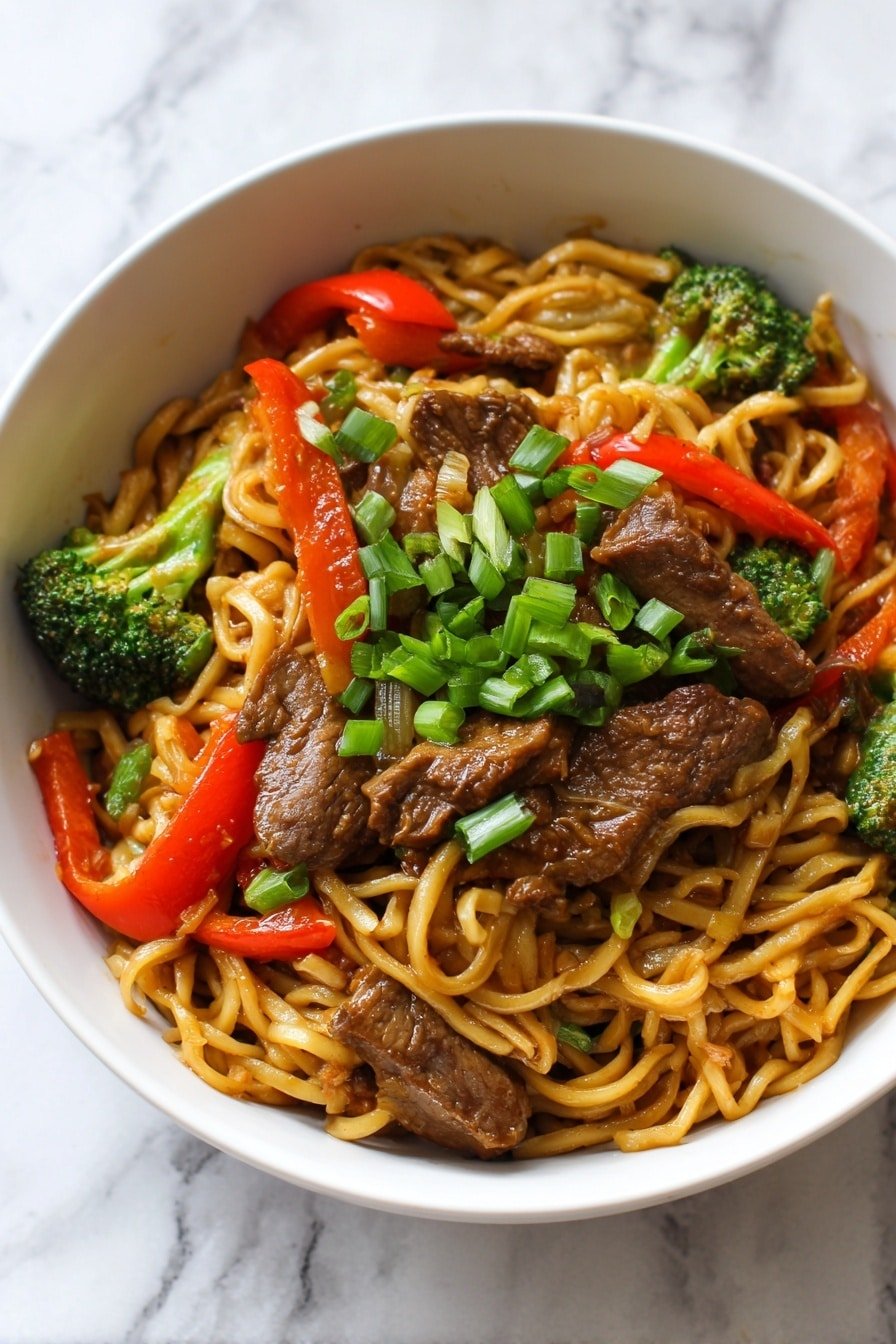 Savory Mongolian Beef Noodles Recipe - Article Image 1 — Savory Mongolian Beef Noodles, Mongolian beef stir-fry with noodles, Chinese beef noodle recipes, quick Mongolian beef dinner, hearty beef noodle bowls