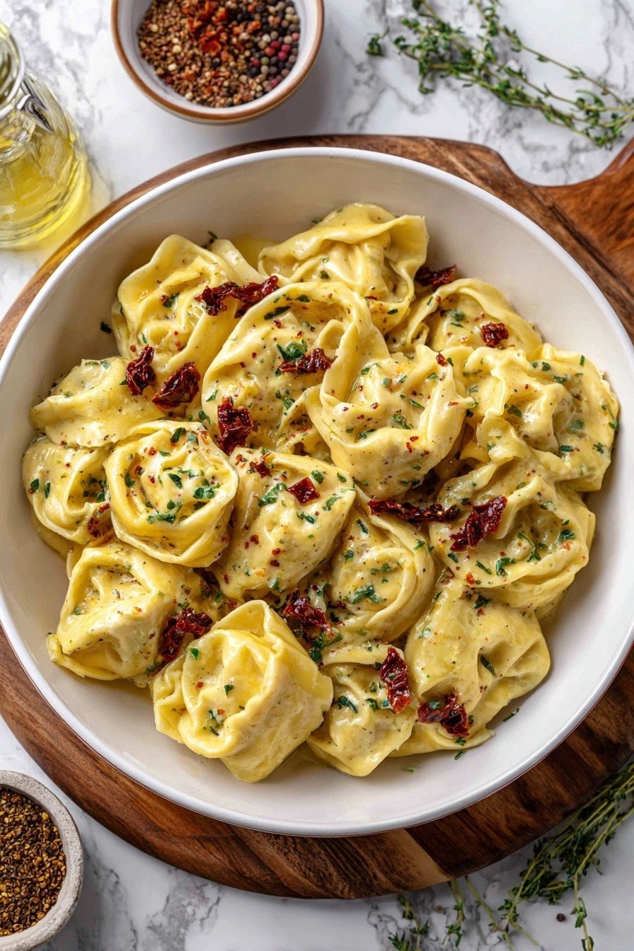 Creamy Spicy Garlic Chicken Tortellini Recipe - Article Image 1 — Creamy Spicy Garlic Chicken Tortellini, spicy garlic chicken pasta, creamy chicken tortellini recipe, easy flavorful pasta dinner, quick garlic chicken pasta
