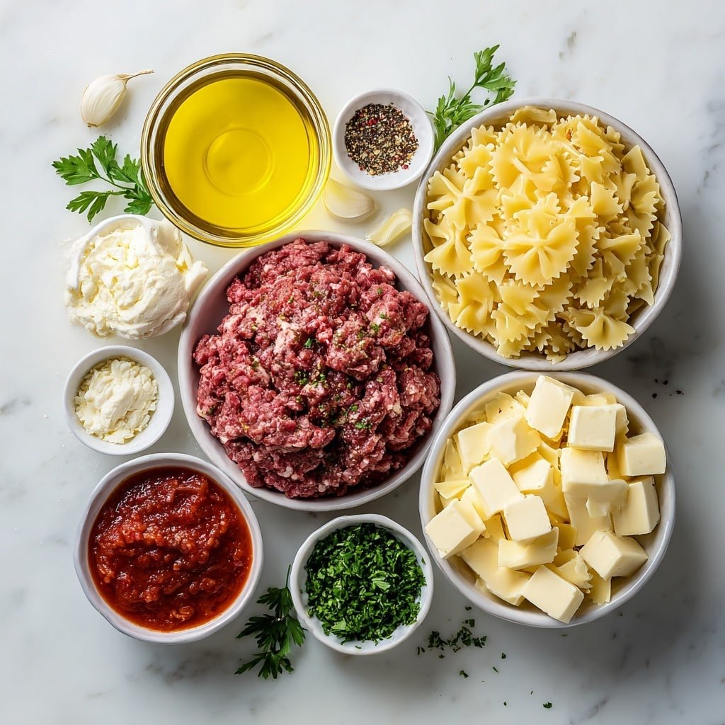 Creamy Velveeta Beef Bowtie Pasta Recipe - Ingredients Image — Creamy Velveeta Beef Bowtie Pasta, creamy pasta with beef and Velveeta, quick cheesy beef pasta recipe, comforting pasta dinner ideas, easy weeknight pasta