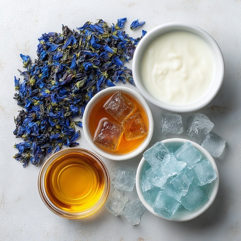 Flat lay of dried vibrant blue butterfly pea flowers loosely scattered, a small white ceramic bowl filled with steaming clear hot water, a small white ceramic bowl holding smooth ice cubes, a small white ceramic bowl with creamy whole milk, a small white ceramic bowl containing glossy amber vanilla syrup, all arranged symmetrically and balanced, placed on a clean white marble surface, soft natural light, photo taken with an iPhone, professional food photography style, fresh ingredients, white ceramic bowls, no bottles, no duplicates, no utensils, no packaging --ar 1:1 --v 7 --p m7354639359234015250 — Blue Butterfly Pea Latte, Blue Butterfly Pea Flower Drink, Healthy Butterfly Pea Latte, Vibrant Blue Latte Recipe, Floral Butterfly Pea Tea Latte