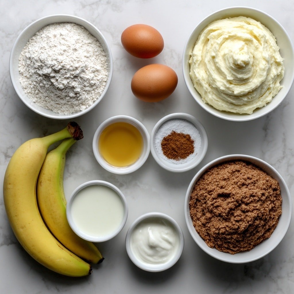 Flat lay of a small mound of white flour, a small pile of protein powder, a neat heap of fine baking soda powder, a tiny mound of baking powder, a pinch of coarse salt crystals, a small pile of ground cinnamon, a small white bowl filled with creamy mashed overripe banana, another small bowl holding thick creamy yogurt, a small white bowl containing golden maple syrup, a small white bowl with pale oil, a small white bowl of clear vanilla extract liquid, and two whole, uncracked brown eggs, arranged with perfect symmetry and balanced proportions, all placed on a clean white marble surface, soft natural light, photo taken with an iPhone, professional food photography style, fresh ingredients, white ceramic bowls, no bottles, no duplicates, no utensils, no packaging --ar 1:1 --v 7 --p m7354639359234015250 — High-Protein Banana Bread, healthy banana bread with protein powder, easy banana bread recipe, moist banana bread, nutritious breakfast bread